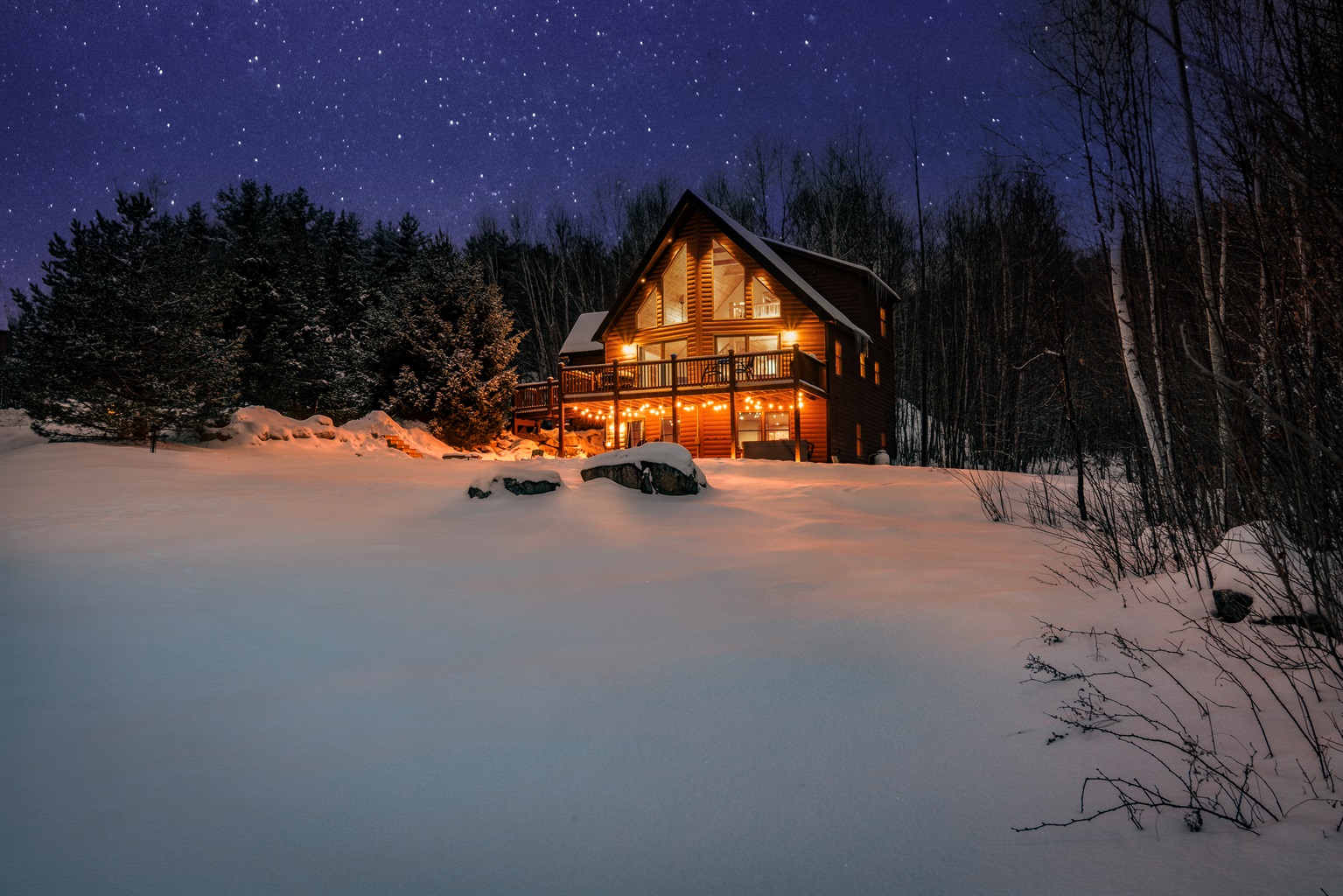 Experience understated luxury as the home comes alive at night.