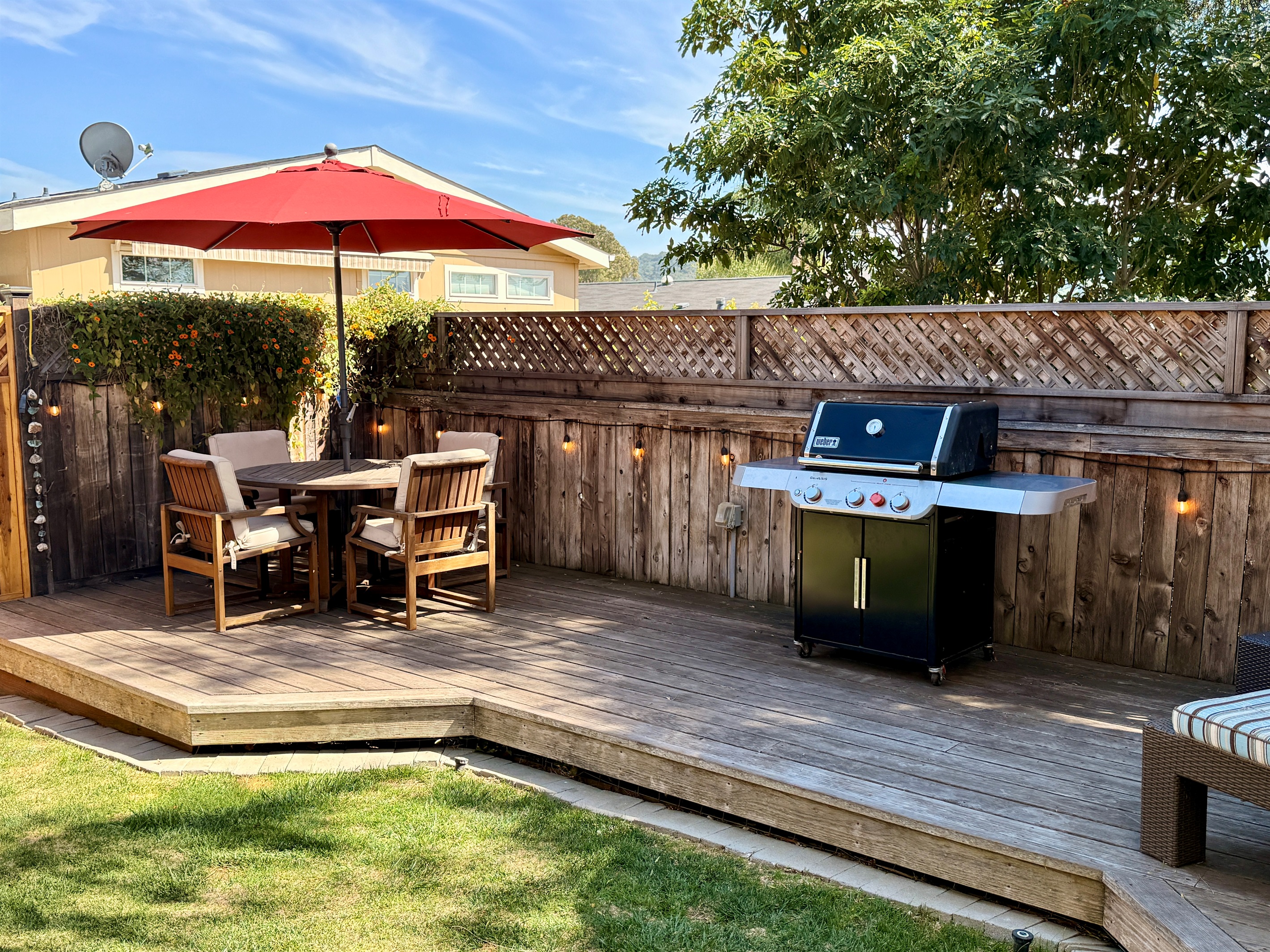 Backyard BBQ! Outdoor deck includes BBQ with tools, 2 chaise lounge chairs, a dining table with 4 chairs, and 2 camping rocker chairs (stored in garage).