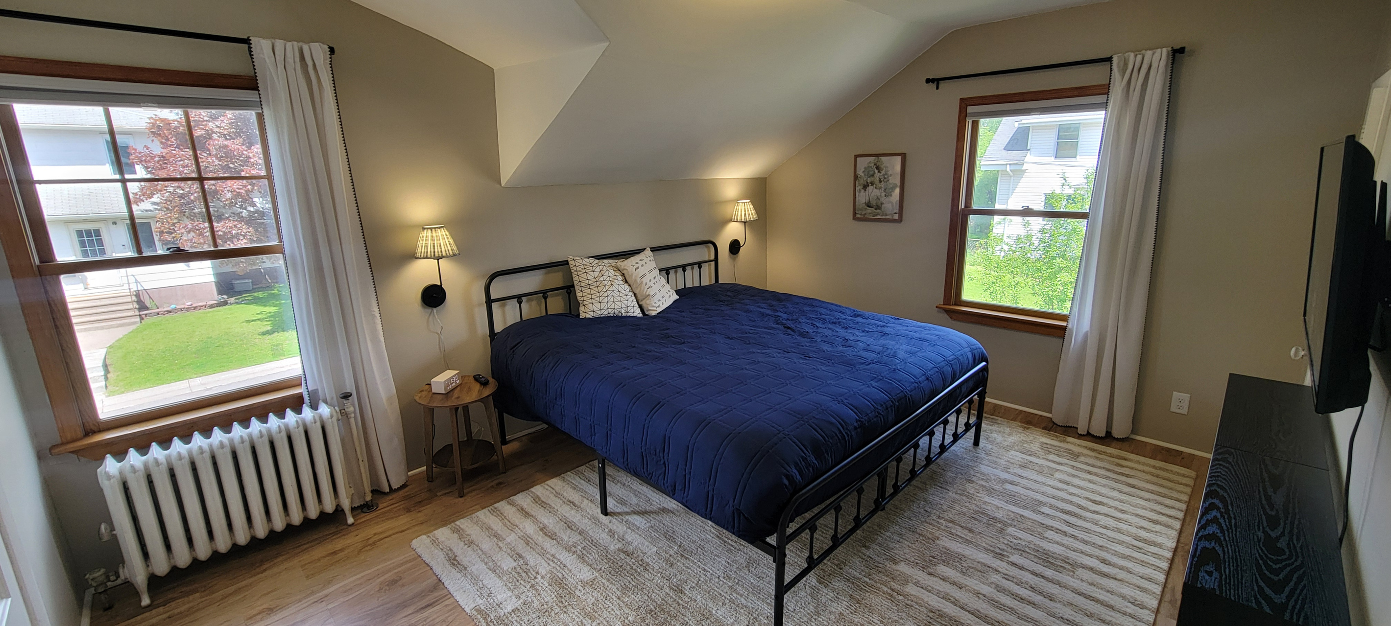 Main bedroom with a comfortable king bed and cozy setup for a restful night.