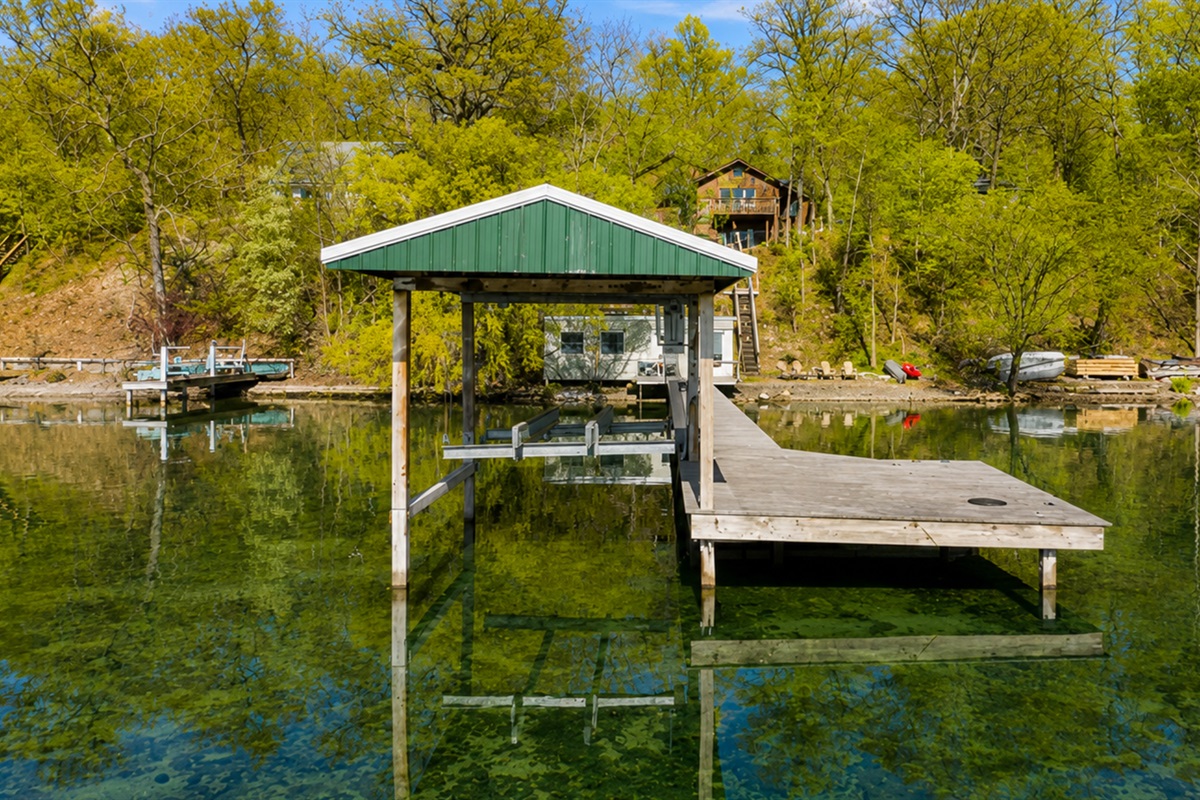 Lakefront / Boathouse / Dock (requires three flights of stairs to access) - Experience serene lakeside living with our private dock and boathouse, perfect for relaxation and water activities. Ideal for those seeking a peaceful waterfront getaway. 