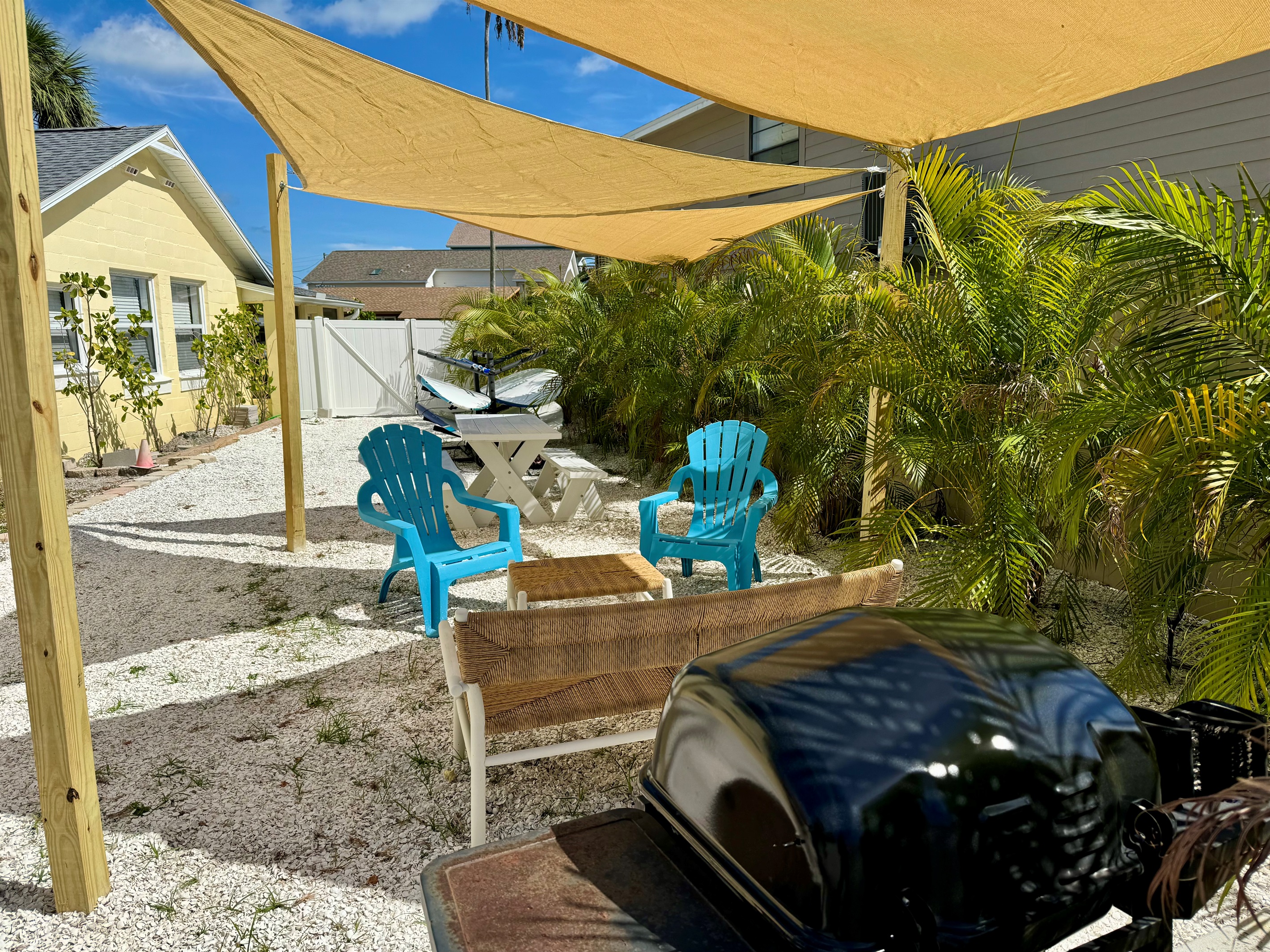 Outdoor lounge with seating and gas grill