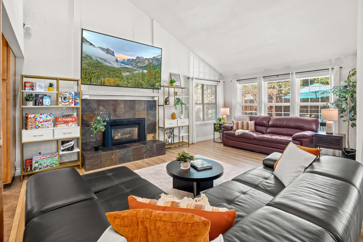 Make yourself comfortable in this bright and spacious living room, with plenty of seating for everyone to gather, relax, and enjoy time together.