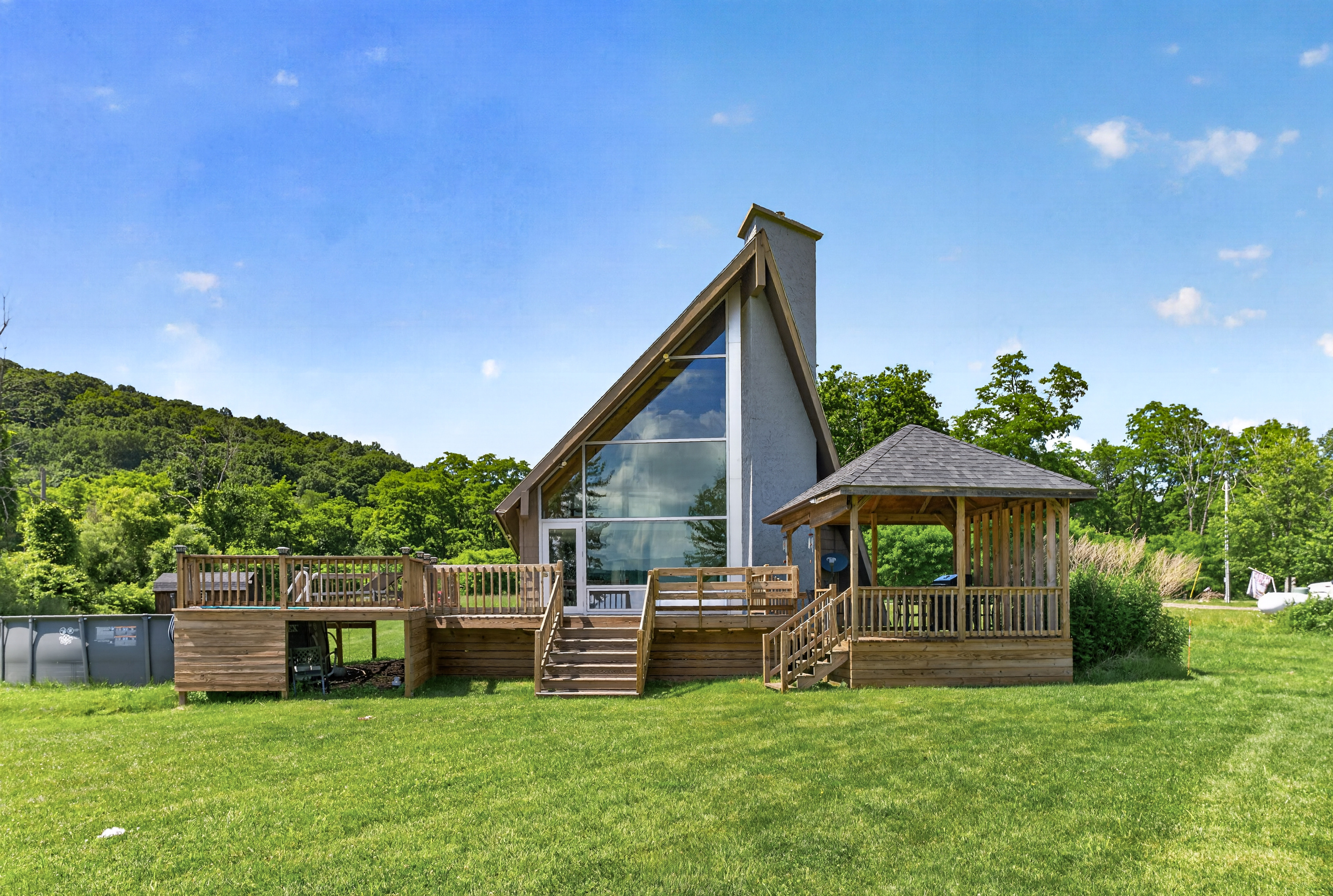 Home with wraparound deck and large windows