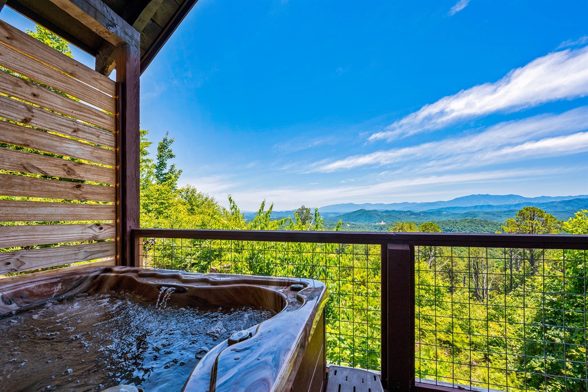 The hot tub at Azure Heights has amazing mountain views!