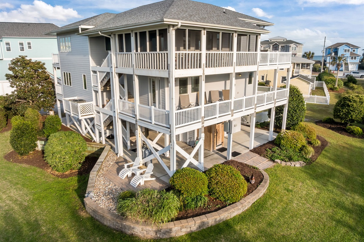 Wraparound decks and lush landscaping offer multiple spaces to relax and unwind
