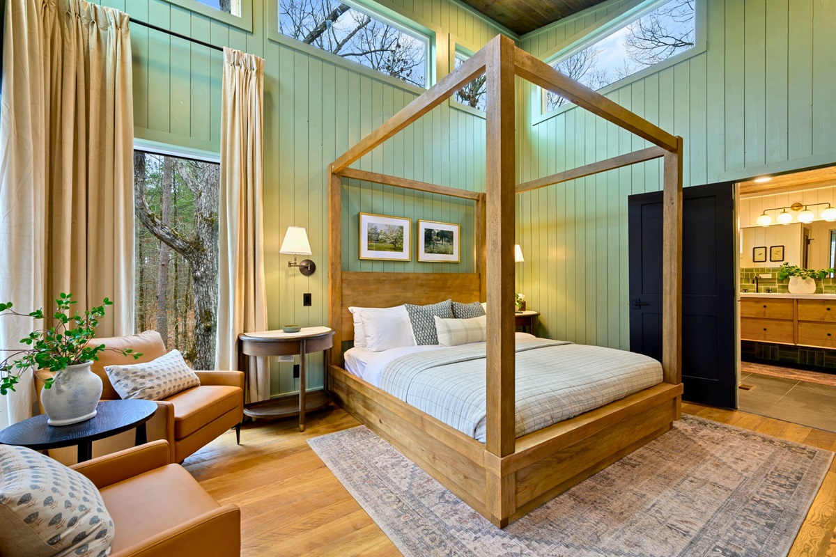 An alternate view highlights the warm wood accents and soft lighting that make this room feel extra inviting.