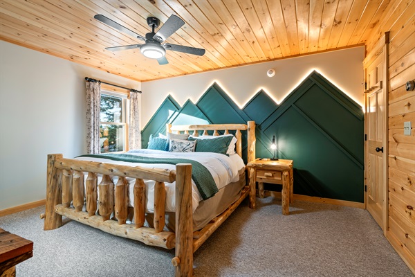 The first bedroom boasts a spacious king bed for a restful night’s sleep.