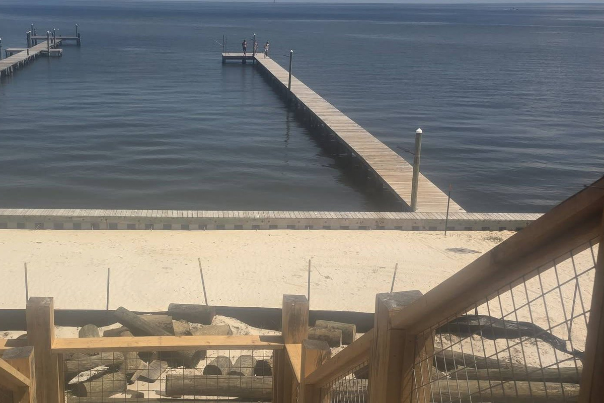 Your own private beach area with shared pier access