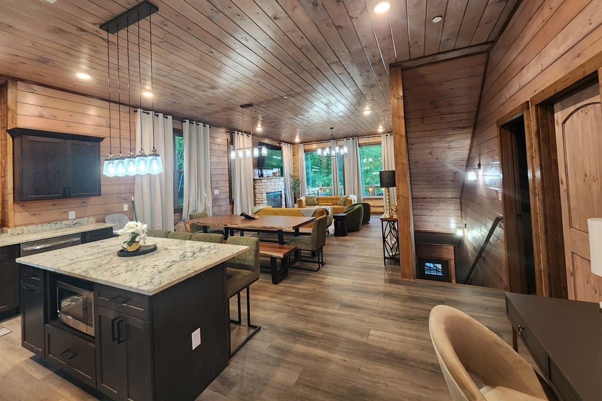 Open-concept living space with high ceilings, perfect for group gatherings.