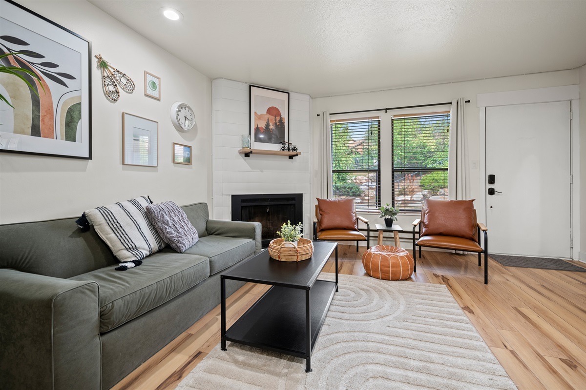Bright living area with comfortable seating and tranquil views of the garden.