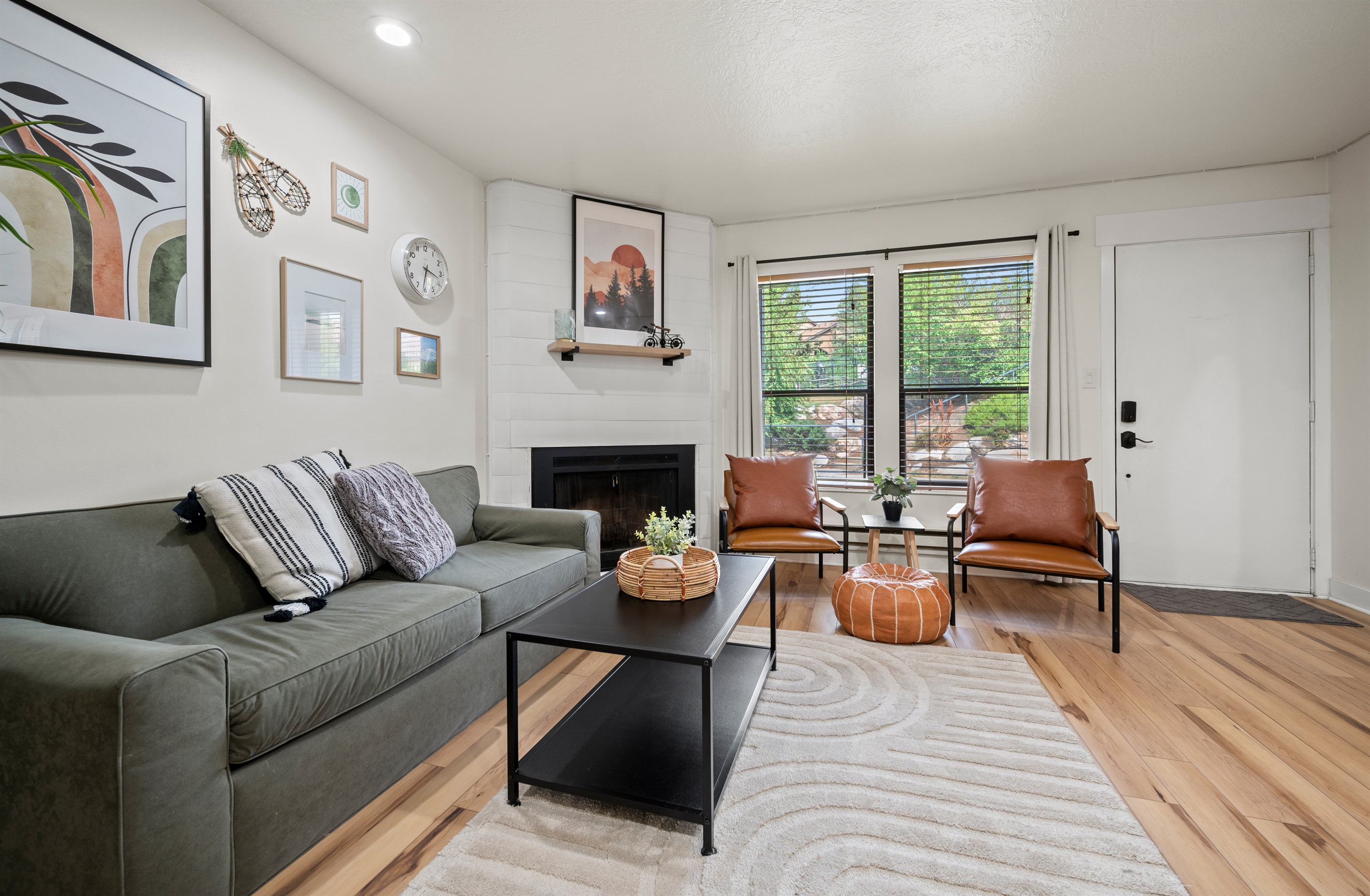 Bright living area with comfortable seating and tranquil views of the garden.