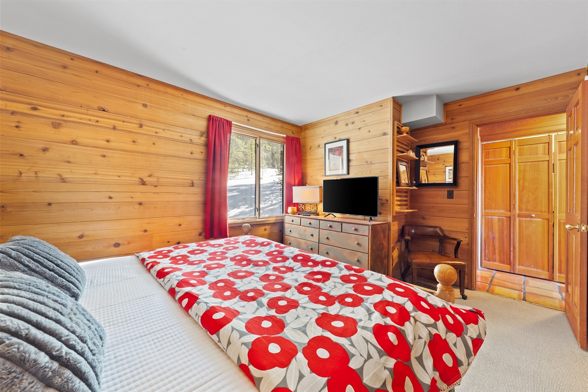 Bedroom #2 with King bed and tv on main level