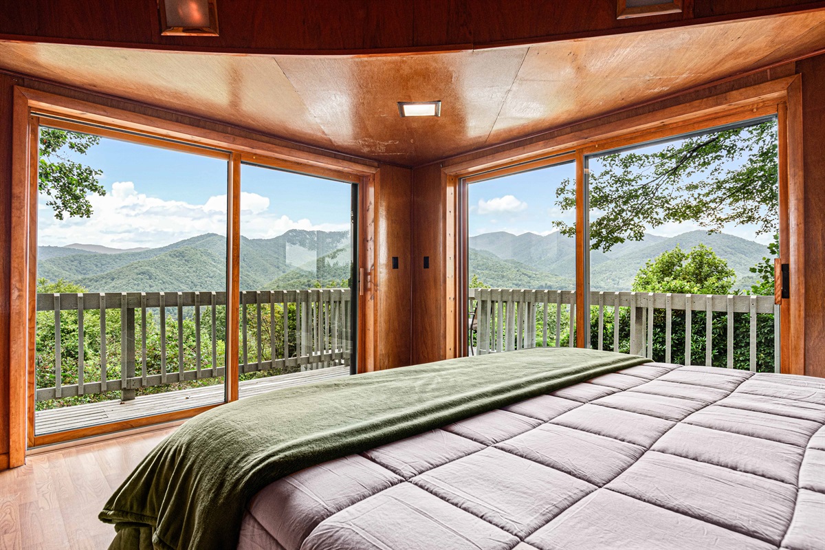 Mountain View Master Suite: Relax and enjoy breathtaking vistas from floor-to-ceiling windows!