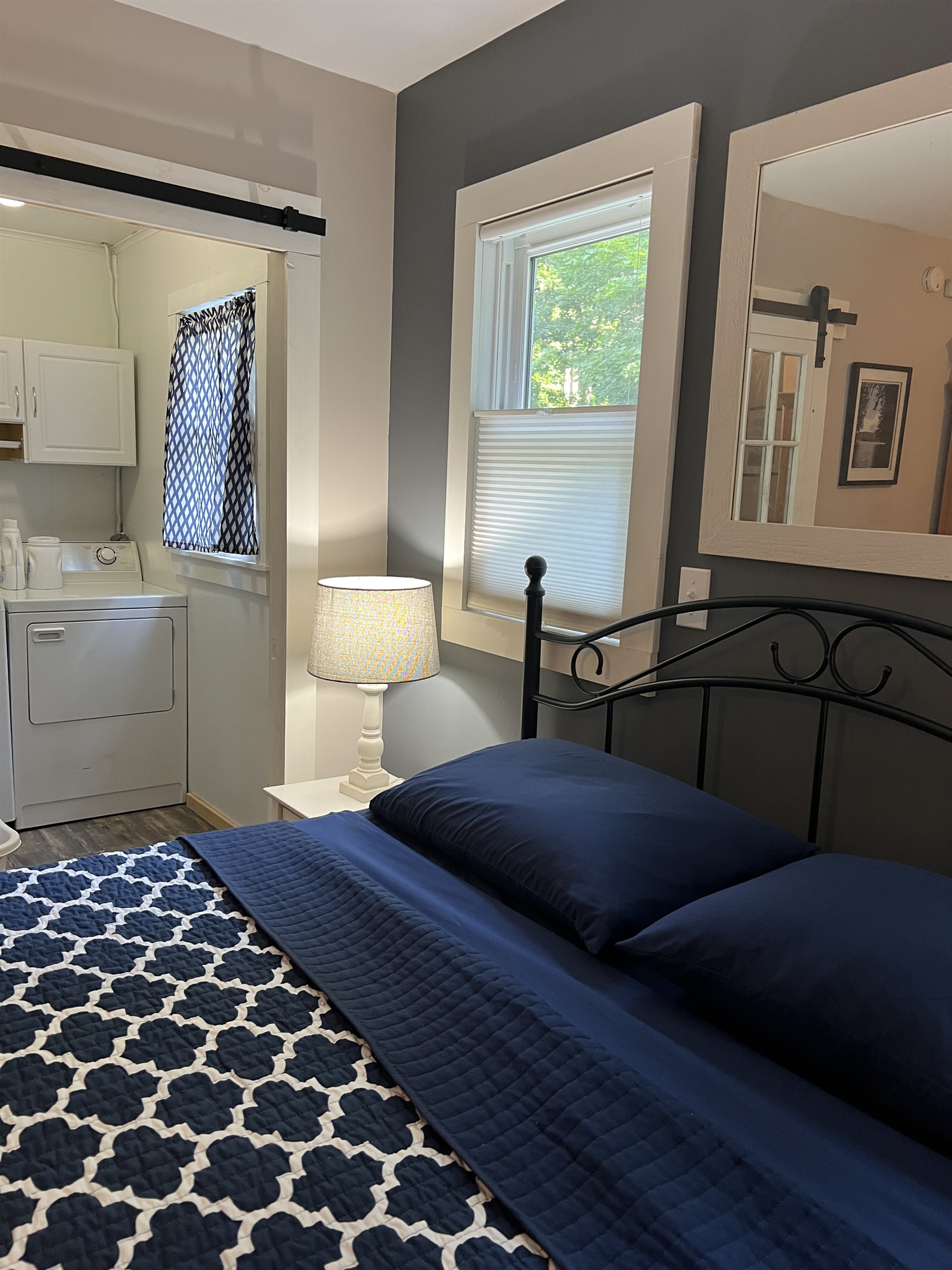 Primary Queen bedroom with laundry room
