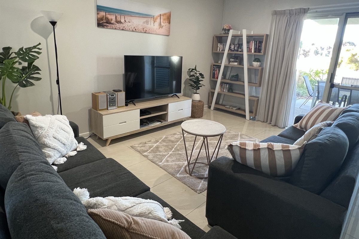 Comfortable Lounge area with large smart tv