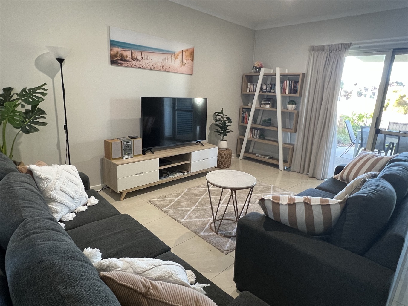 Comfortable Lounge area with large smart tv