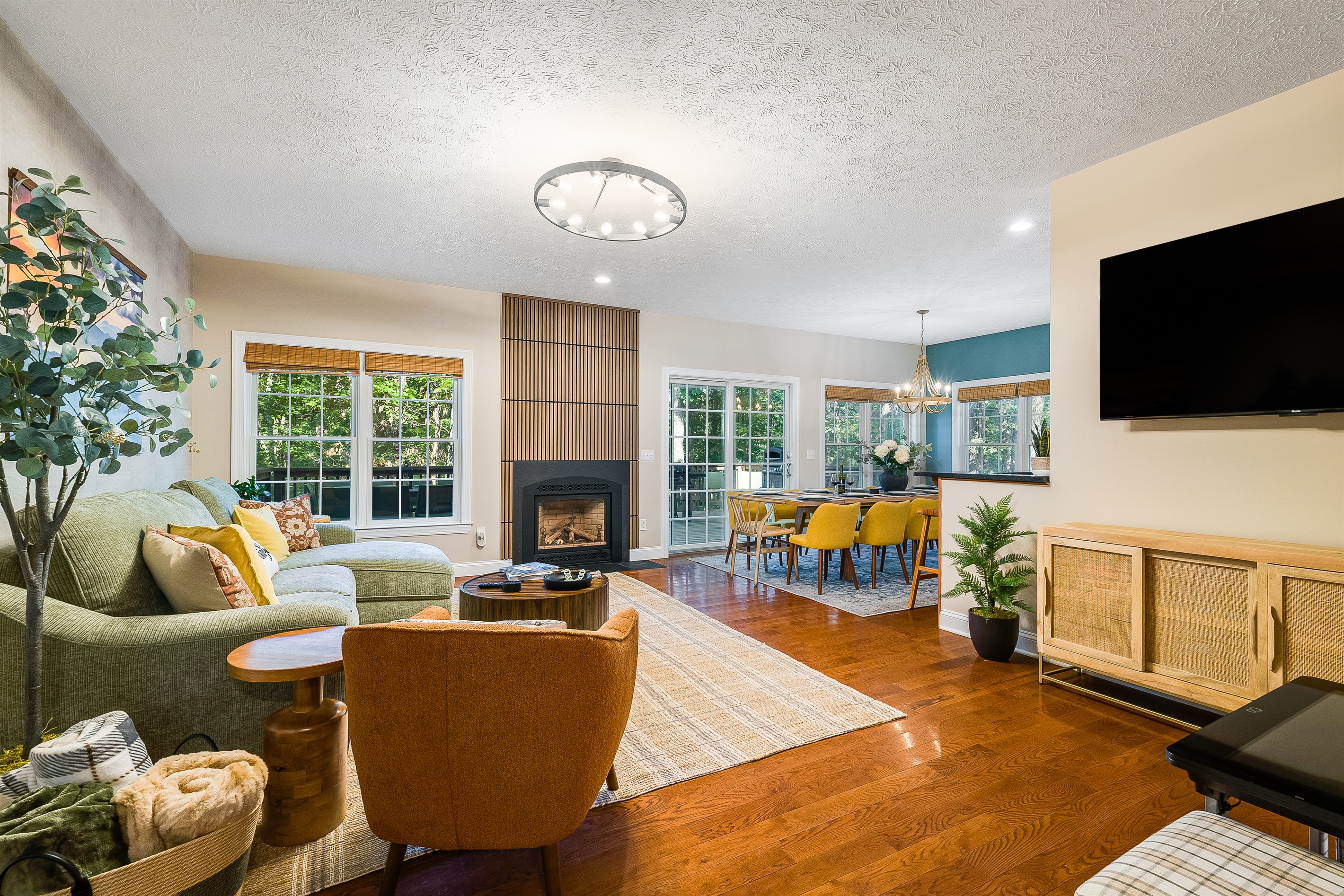 Bright, open living space with a cozy fireplace and plenty of room for everyone to gather. Whether it’s game night or wine night, this is the heart of the home.