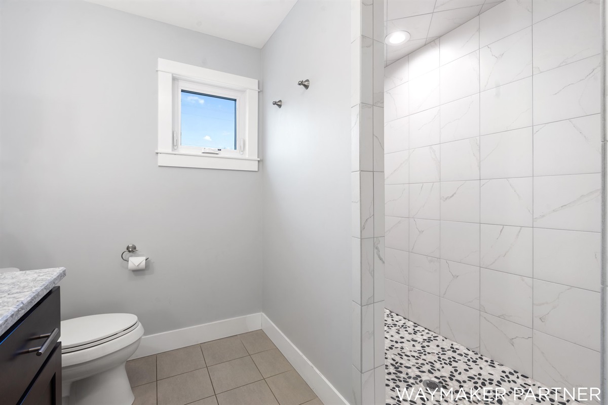 Spacious shower in Bathroom #4. All bathrooms are equipped with shampoo, conditioner, and body wash.