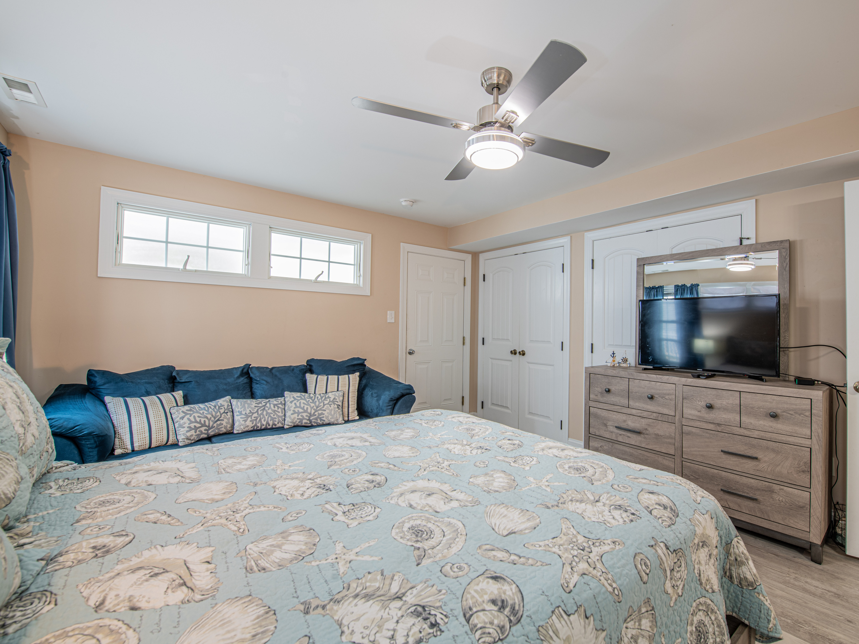 Bedroom 2 View Showing Seashell Quilt, Blue Sofa