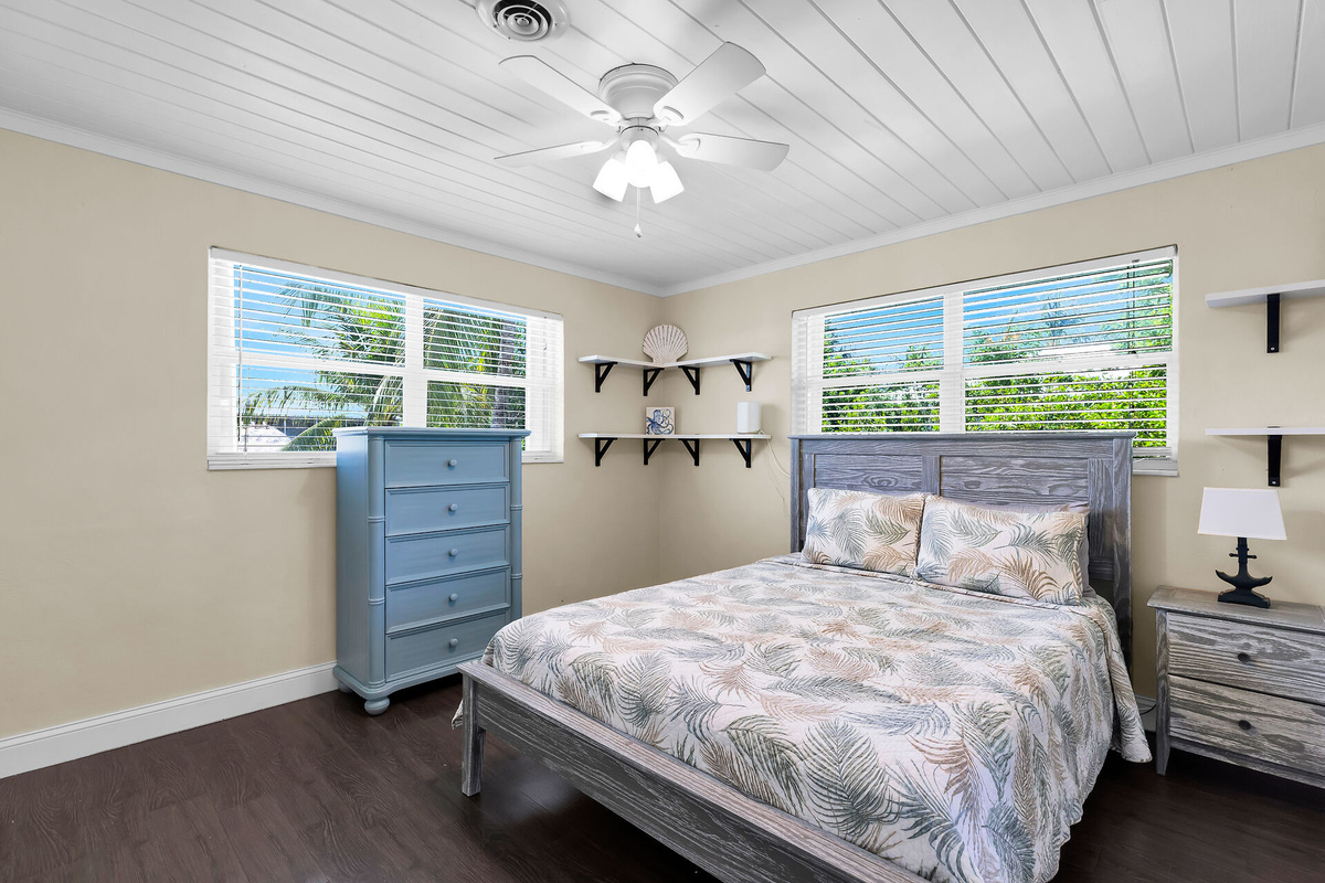 Queen size bed in guest bedroom