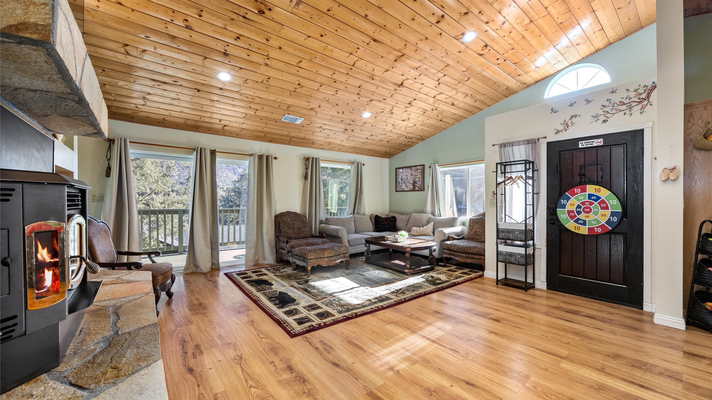 Large windows flood the living room with natural light and frame truly breathtaking views.