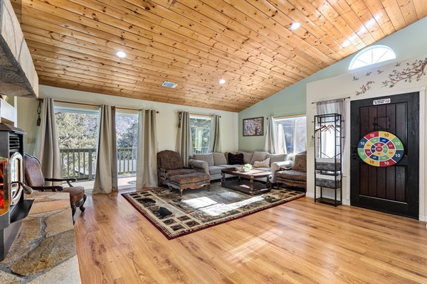 Large windows flood the living room with natural light and frame truly breathtaking views.