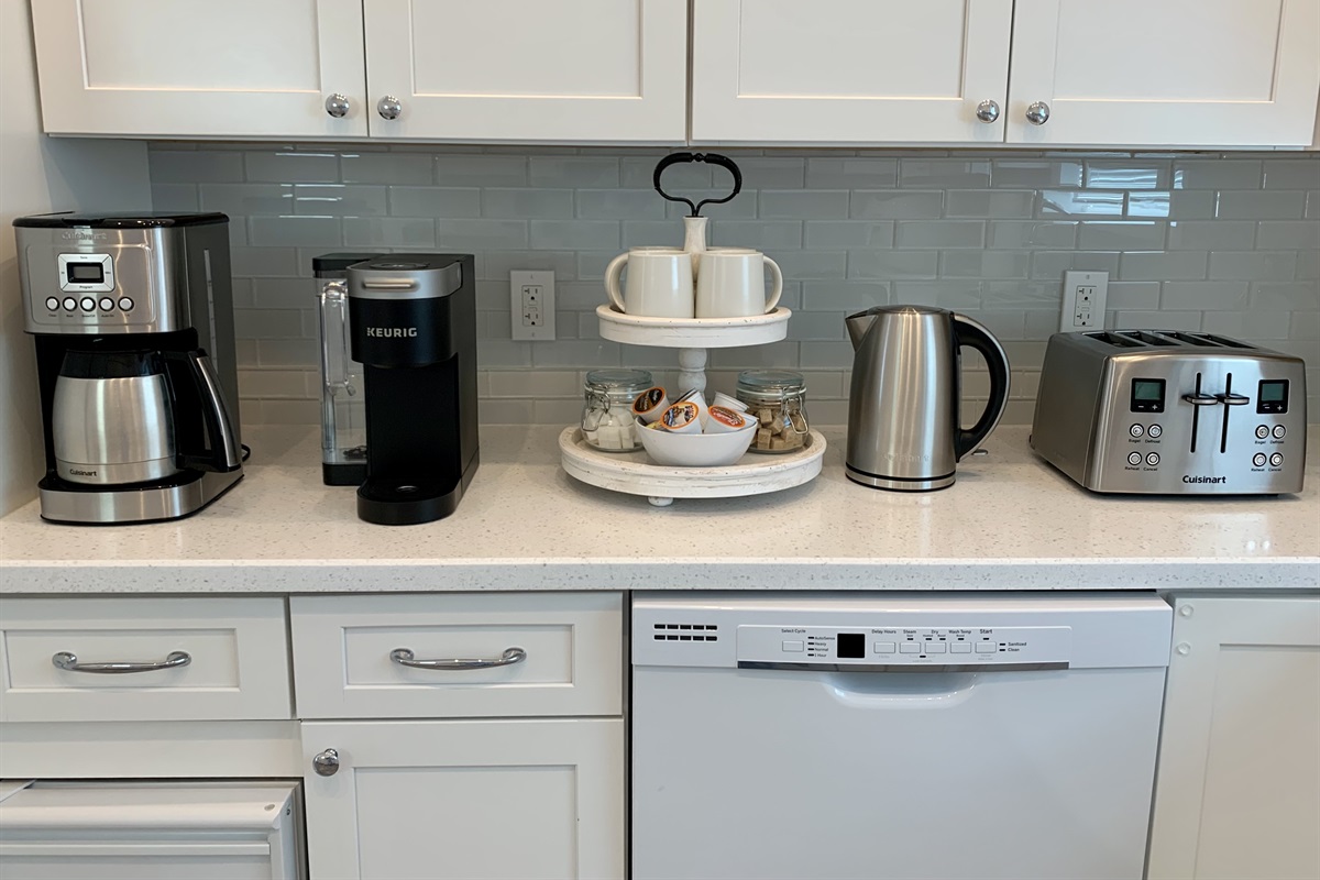 STARFISH BAY Kitchen has spices, sugar, creamers, ground coffee, Keurig coffee pods, tea, Brita water filter pitcher.
