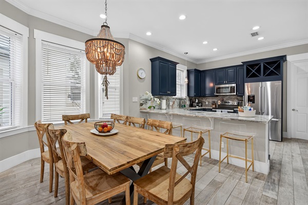 Dining area with seats for 8 at the table and additional 4 at the counter. 