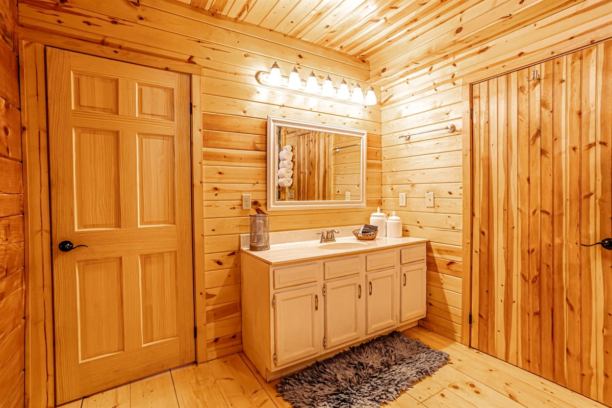 Main floor Master bathroom ONE with hand crafted stone spa tub/shower