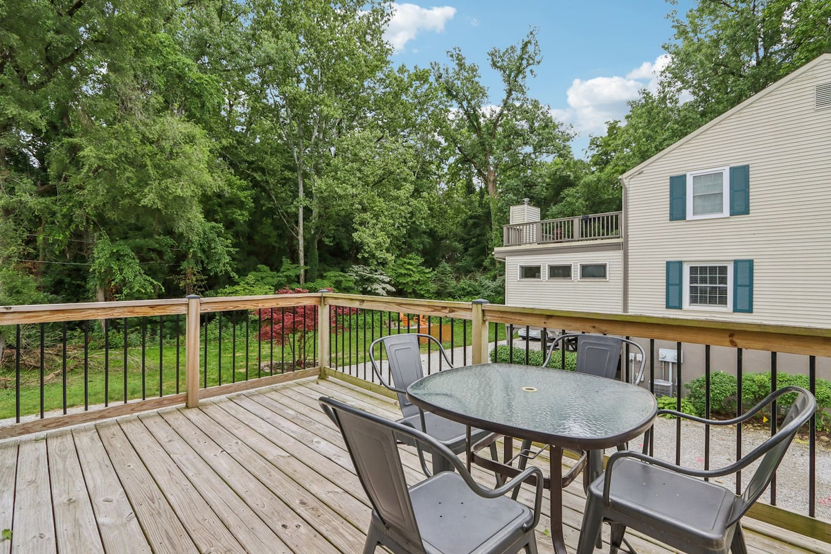 Step outside onto the private deck for fresh air, morning coffee, or a relaxed meal surrounded by greenery.