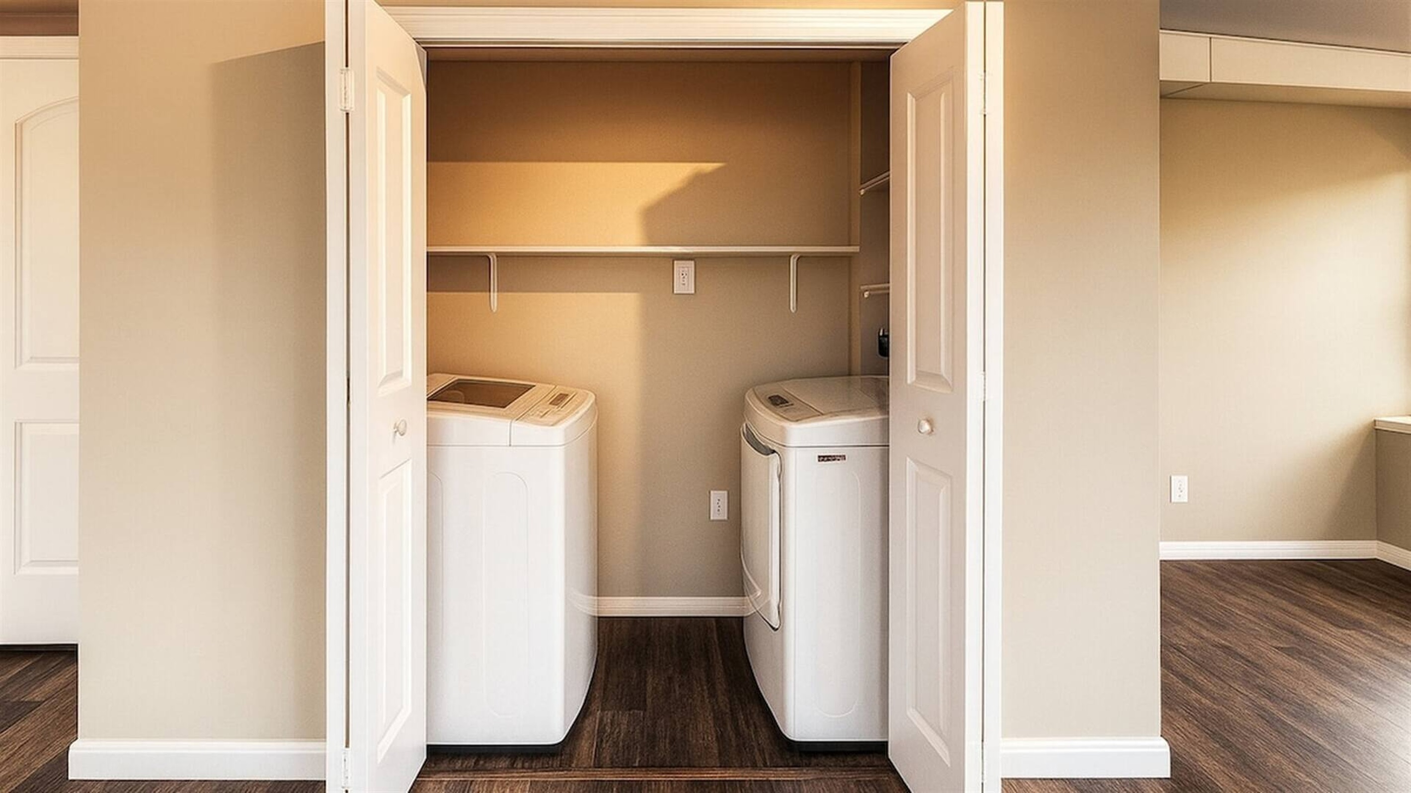 In-unit washer and dryer tucked neatly into a dedicated laundry space, making longer stays comfortable and convenient.