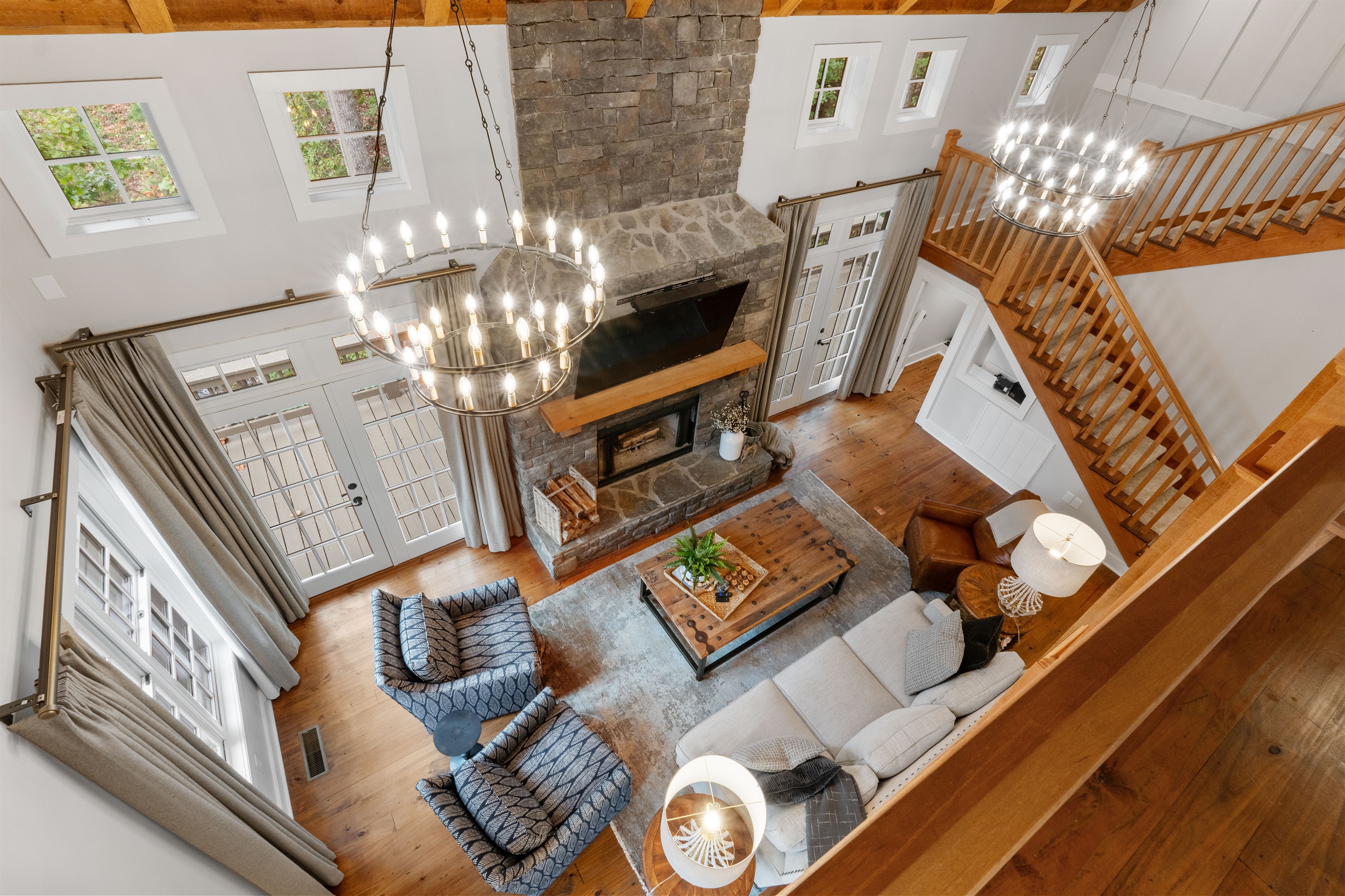 Enjoy a beautiful view from upstairs overlooking the spacious living room, highlighting the open layout and inviting design of the home.