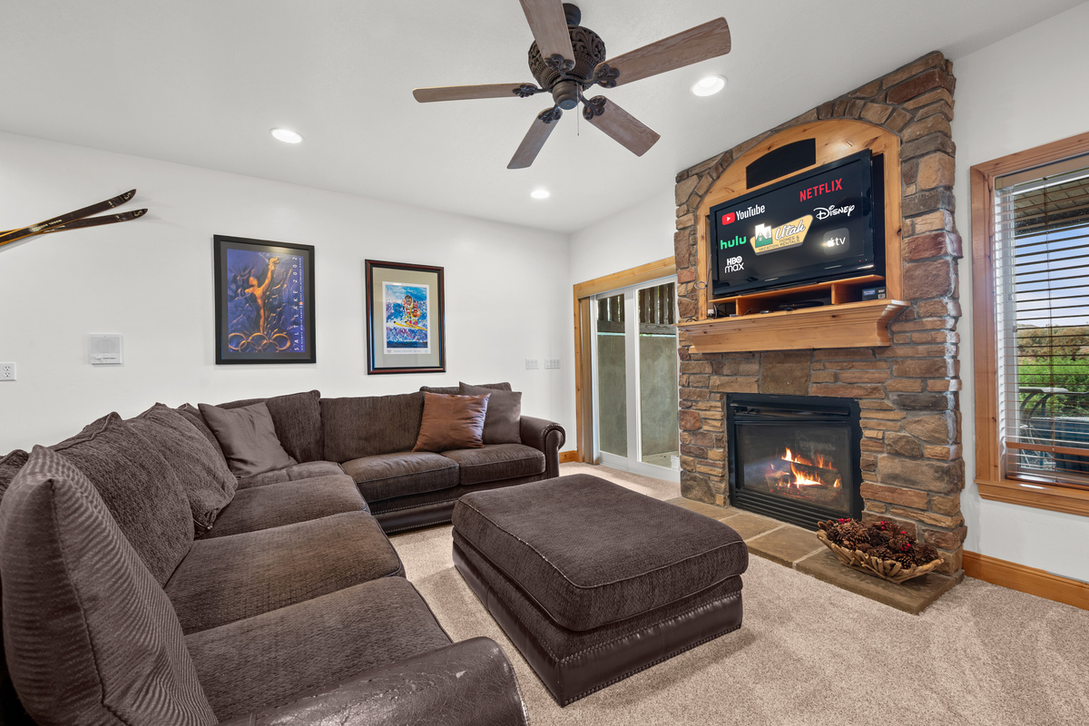 Cozy up by the stone fireplace and enjoy a movie or your favorite show on the large Smart TV.