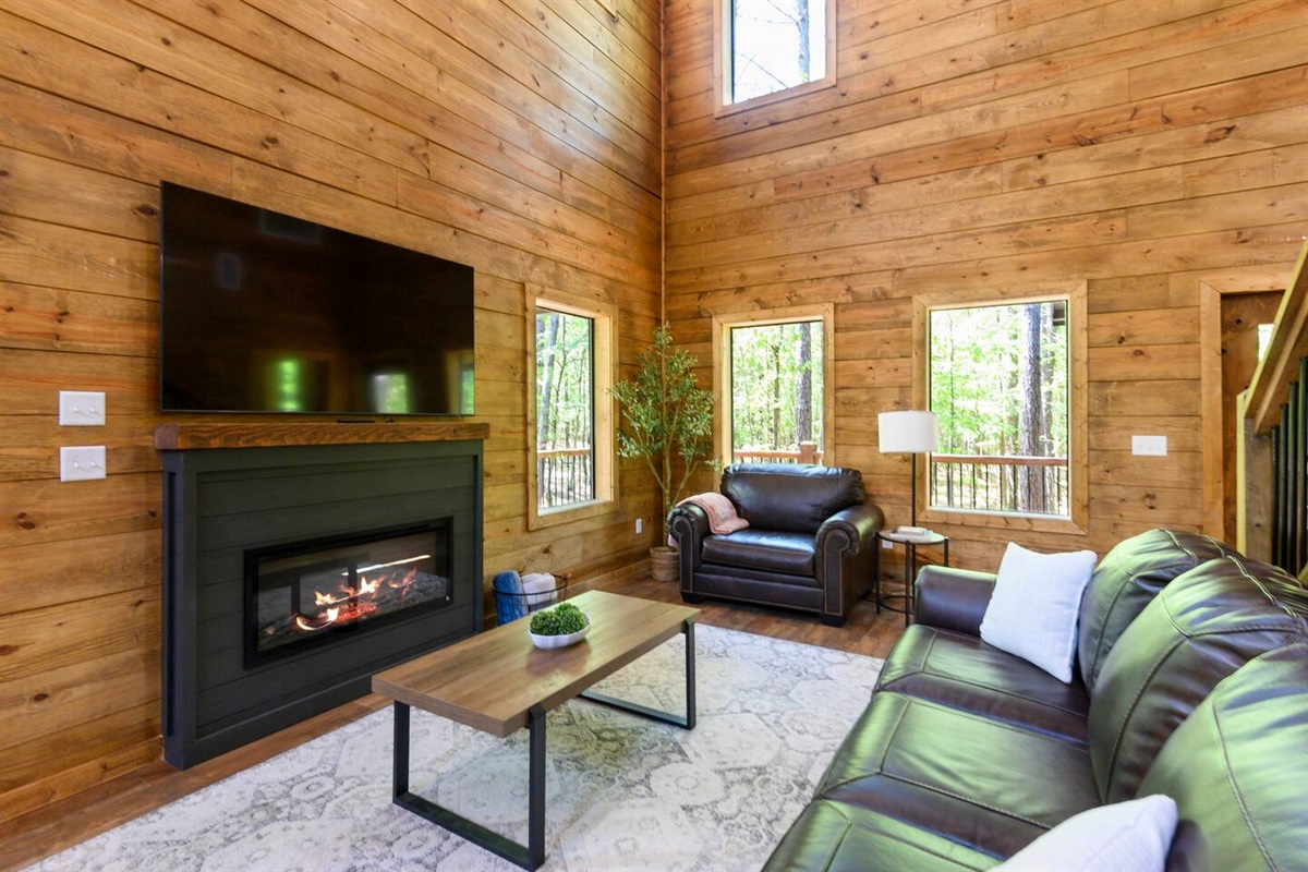 
Sink into deep leather sofas and watch the flames dance in the stone fireplace.