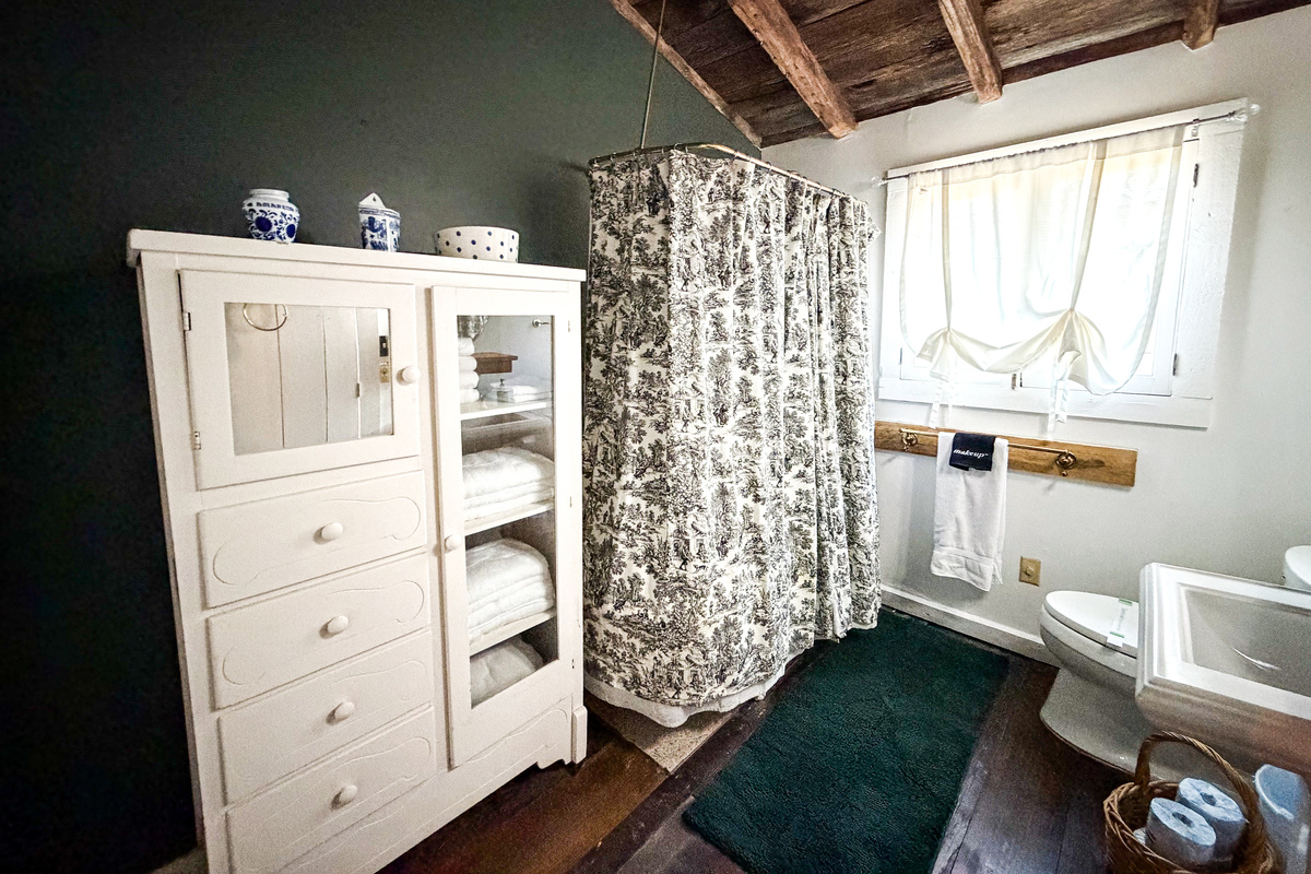 This bathroom is located off of the kitchen.