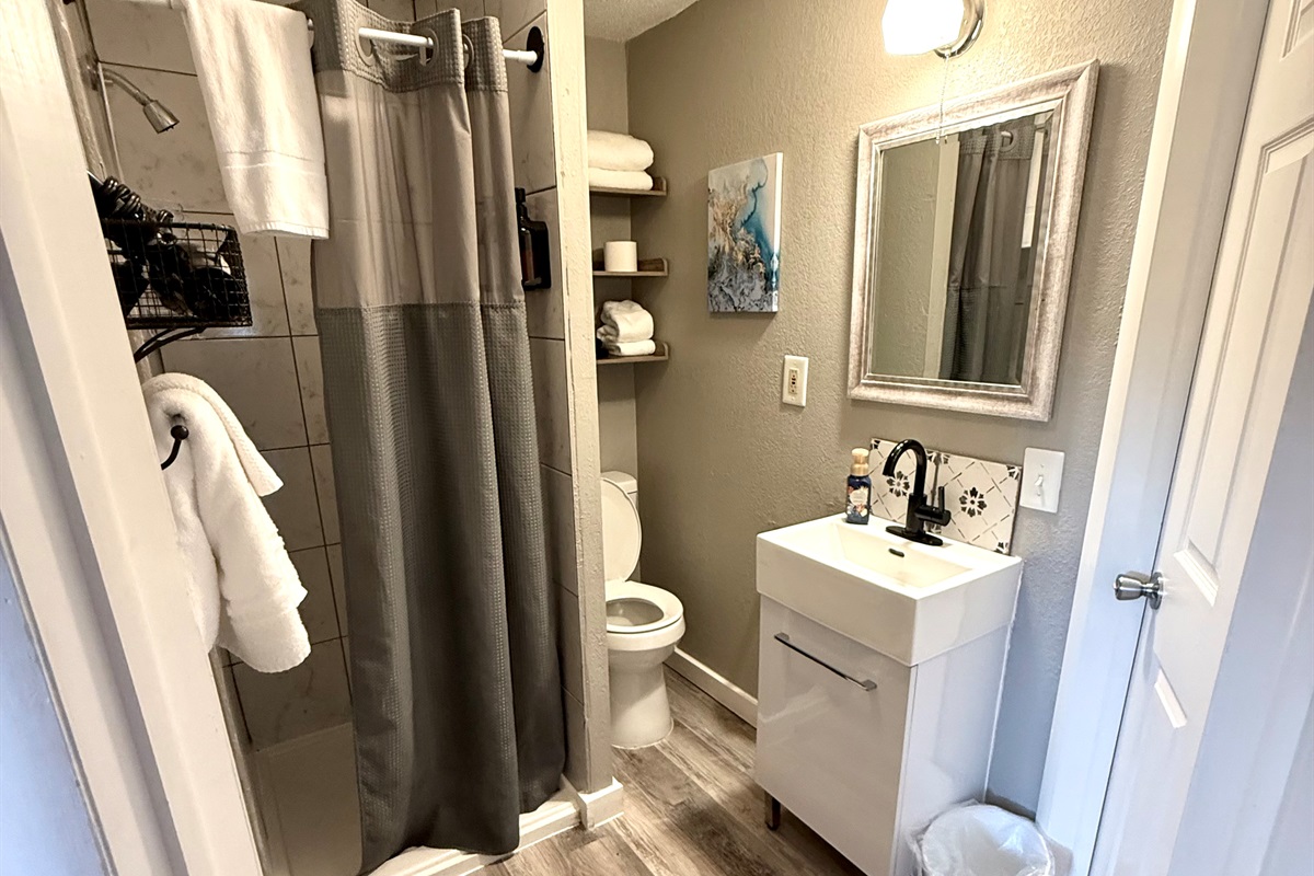 Bathroom. The toilet is close to the wall please be mindful.