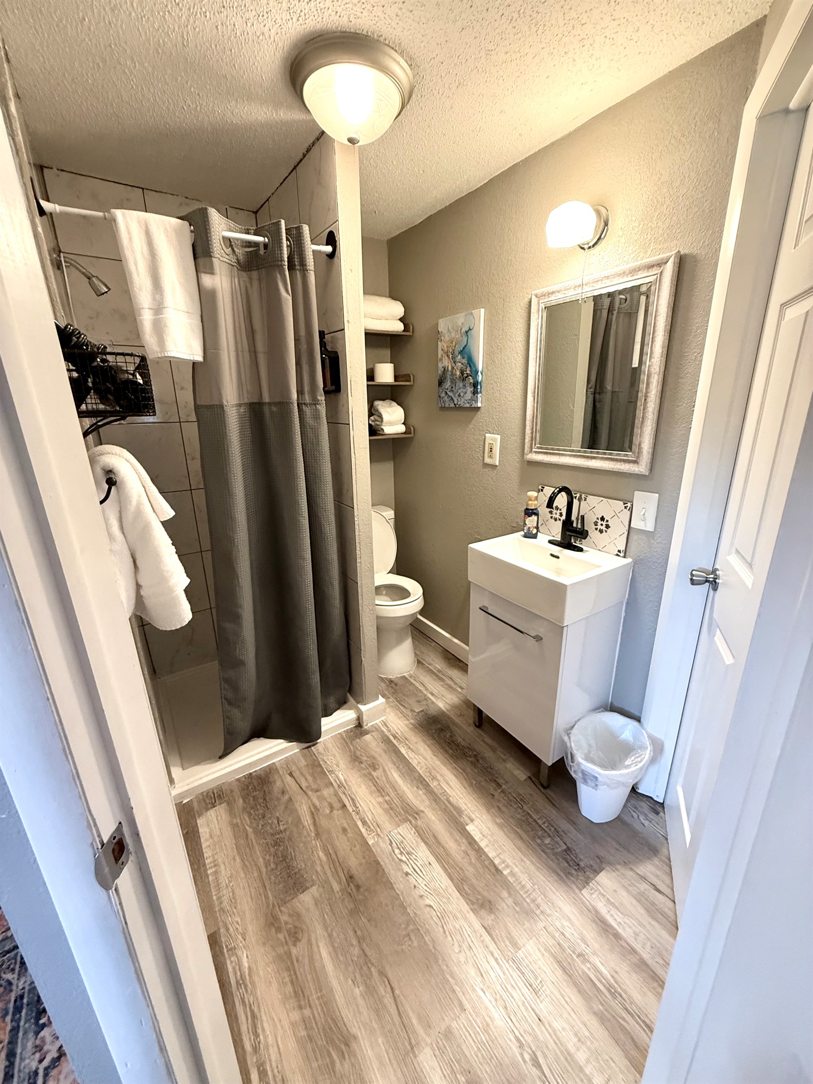 Bathroom. The toilet is close to the wall please be mindful.