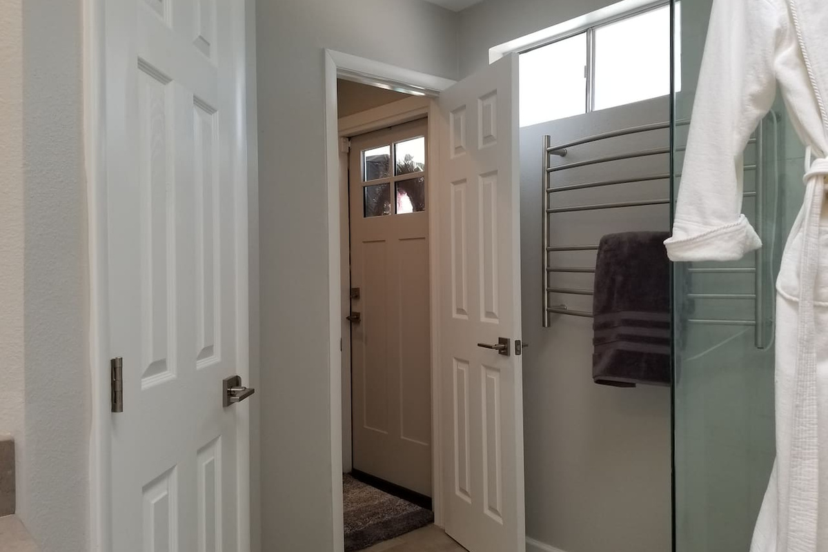 Master bath has a separate Toilet room and backdoor to the pool. Also a towel heater and robe are provided.