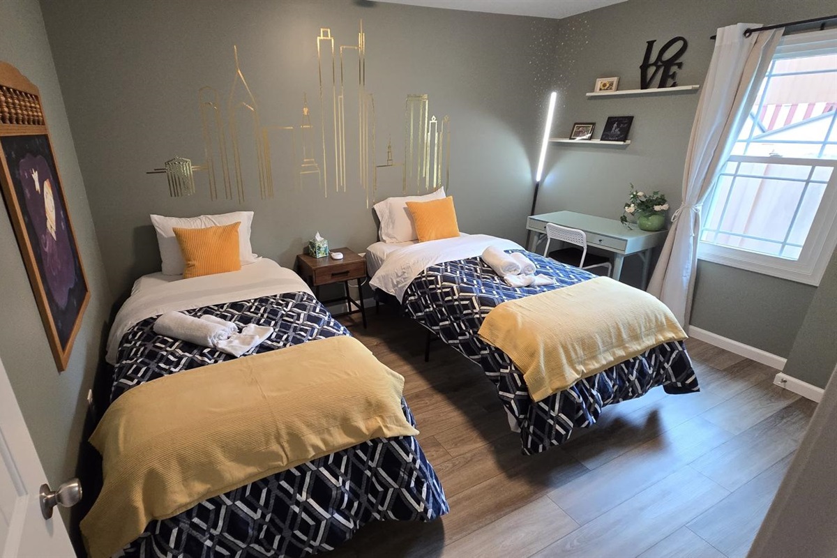 Perfect for the kids or friends, this bedroom features two cozy twin beds