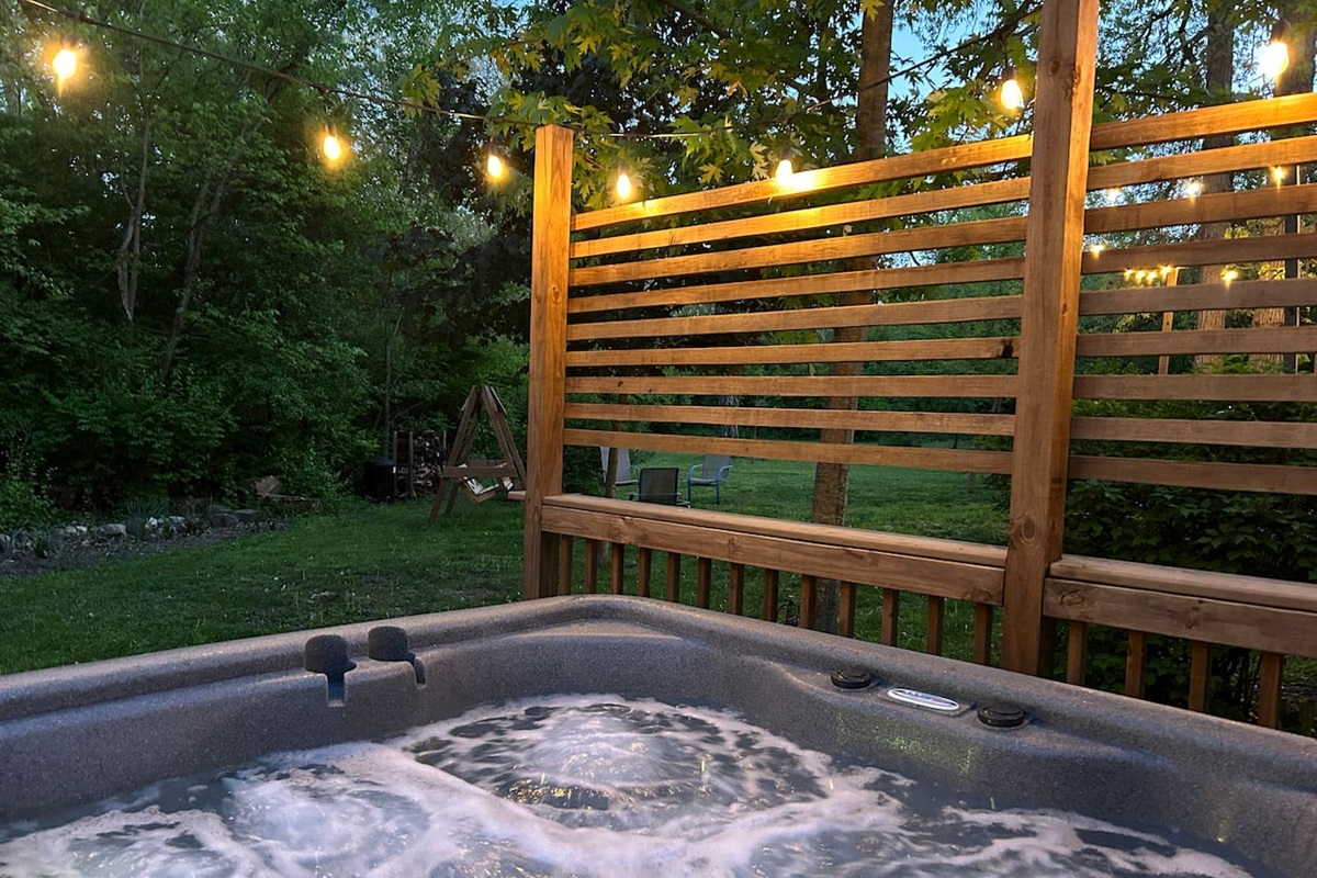 Guests enjoy watching the deer while relaxing in the hot tub. 