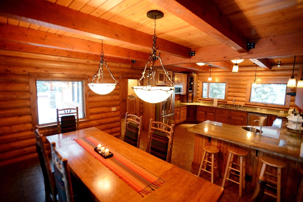 Large dining table with extra chairs available and seating at the counter for 7 