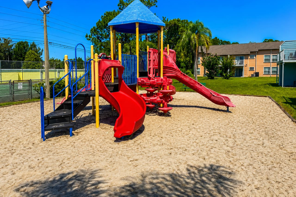 Colorful community playground with slides and climbing features for younger ones