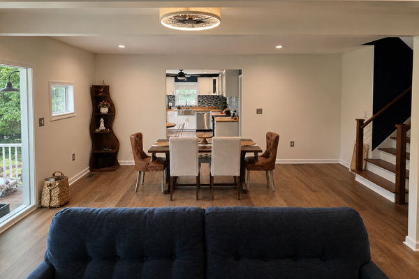 Open main-level living and dining space with comfortable seating, natural light and room to gather.