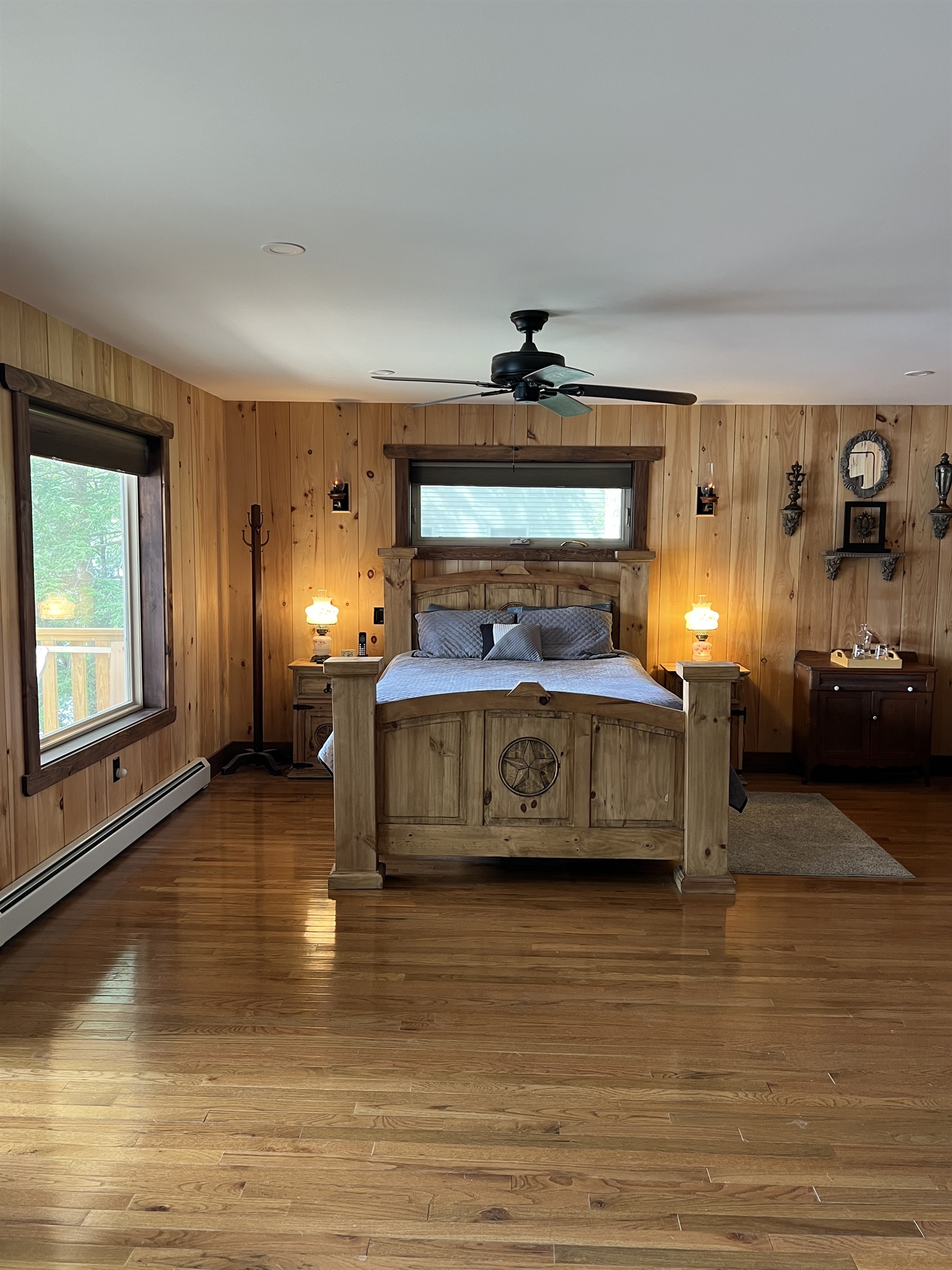 Primary bedroom with deck over looking water