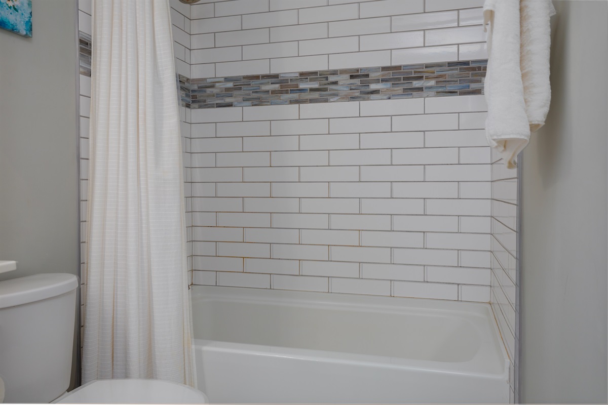 Tile shower/tub in bathroom