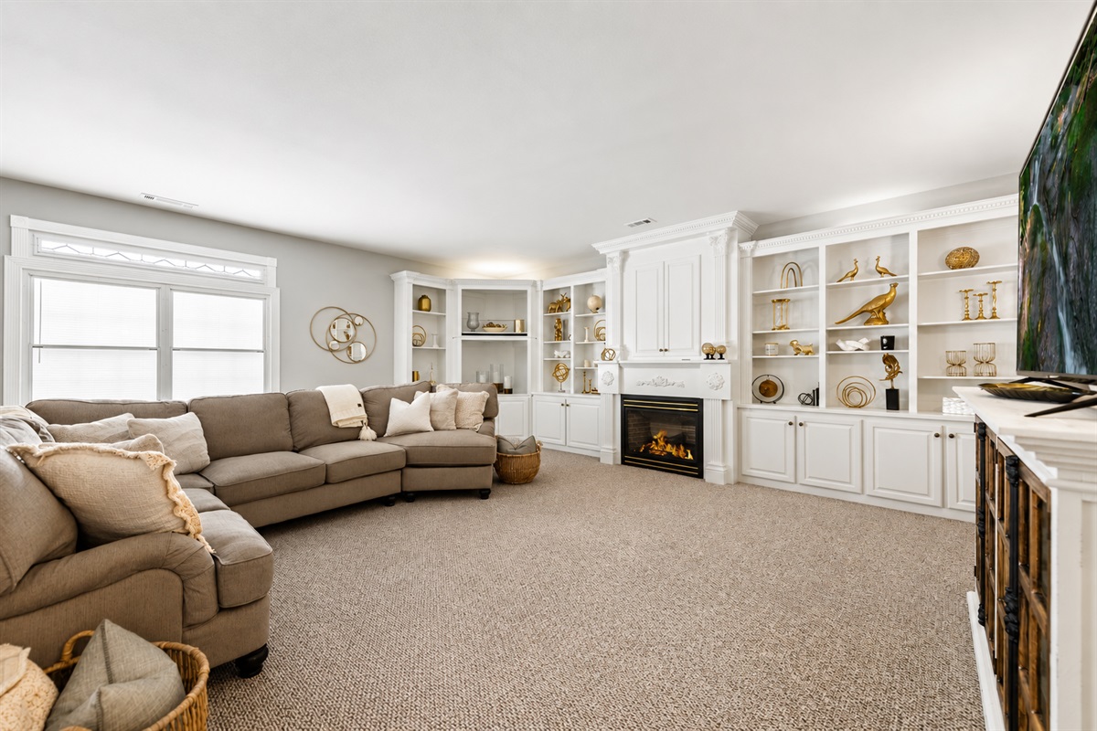 Enjoy cozy evenings by the indoor fireplace in the spacious living area.