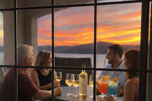 Sunset drinks on the balcony 🌅🍷 — the perfect place to unwind and take in the lake views.