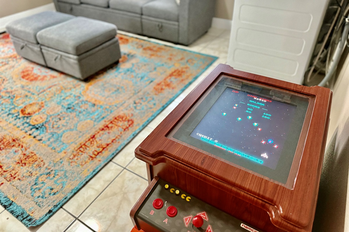 Turn your downtime into playtime with this awesome vintage-style arcade machine, perfectly tucked into the comfort of your lounge space.