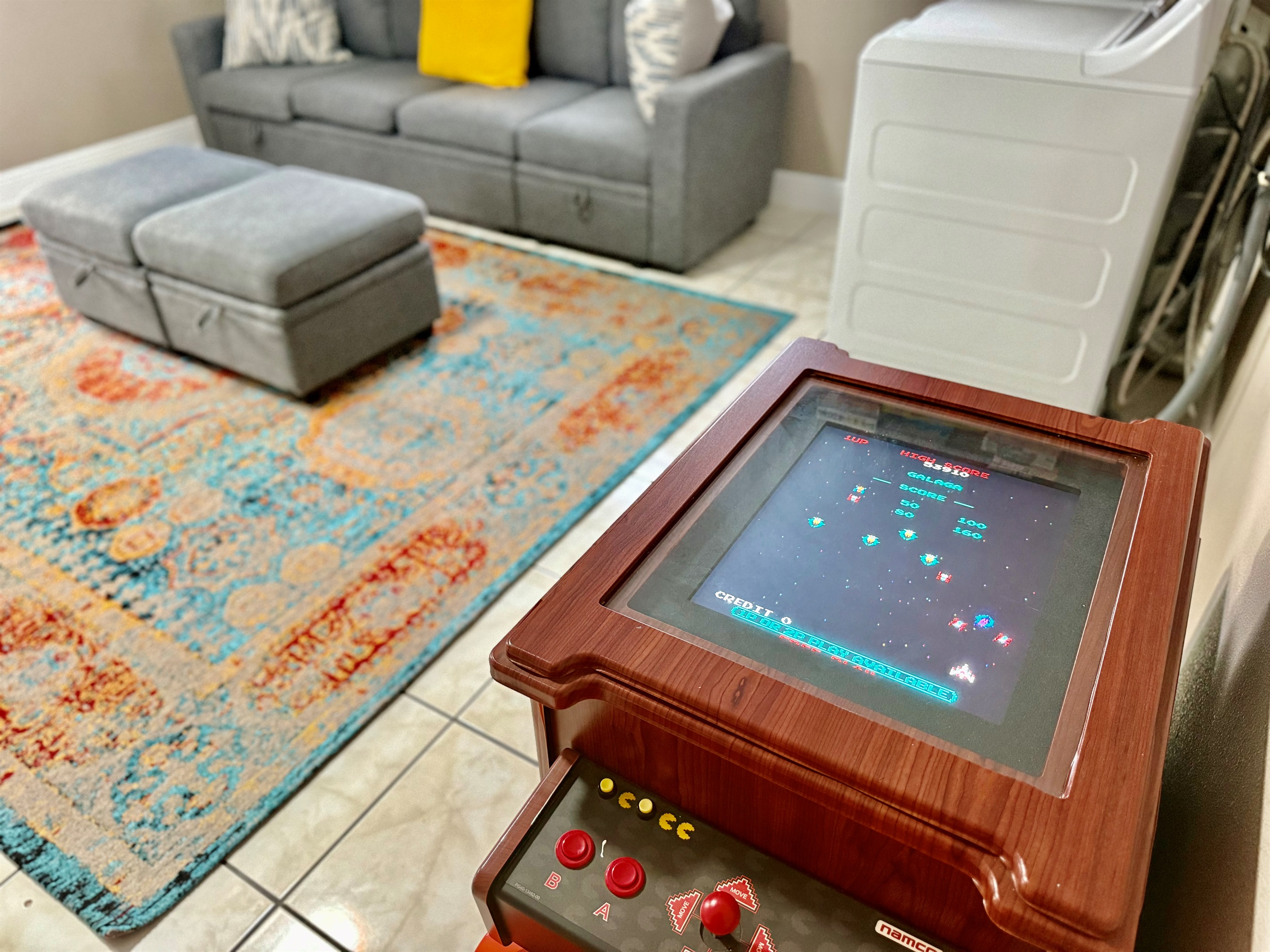 Turn your downtime into playtime with this awesome vintage-style arcade machine, perfectly tucked into the comfort of your lounge space.