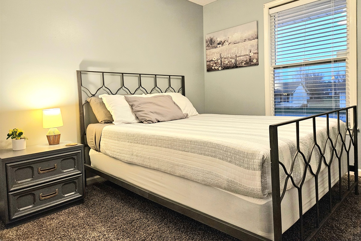 Guest room with memory foam mattress and plenty of natural light. Boasts a new ceiling fan and high speed internet. Optional rollaway bed included.